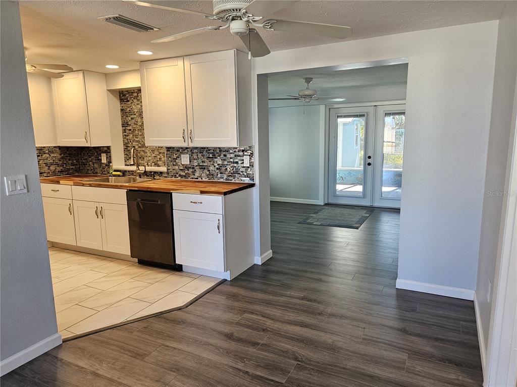 8229 Cypress Road Englewood, FL 34224 - Photo 5 of 44 a large bathroom with a sink and a mirror