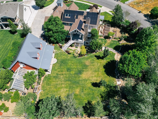 672 Perry Hollow Drive Mapleton, UT 84664 - Photo 16 of 106 Expansive green lawn with mature trees and a stone pathway