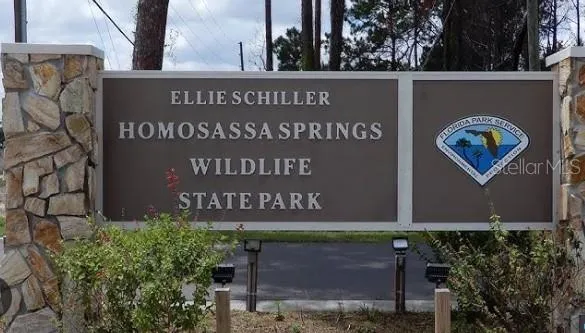 a sign broad on the side of the road