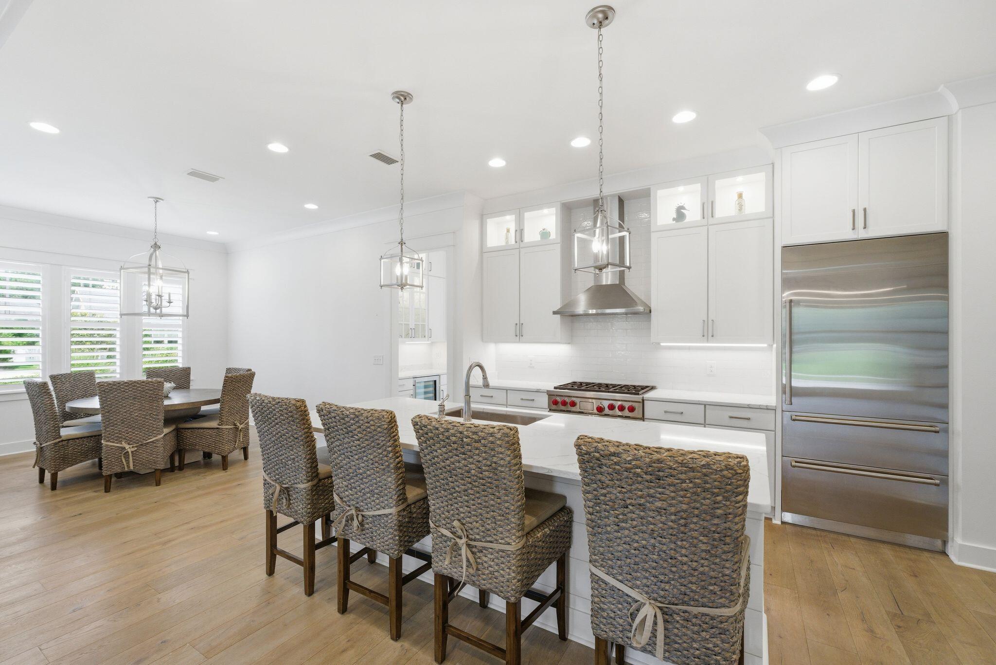 133 Sandchase Circle, Unit LOT 15 Inlet Beach, FL 32461 - Photo 8 of 47 a large kitchen with a table and chairs
