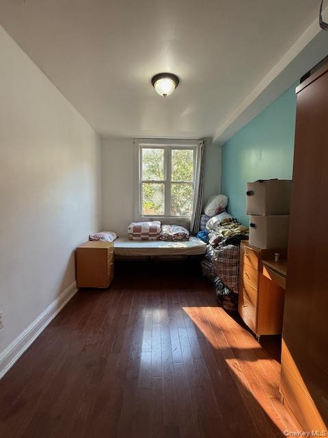 101-18 39th Avenue Queens, NY 11368 - Photo 2 of 13 a living room with furniture and a flat screen tv