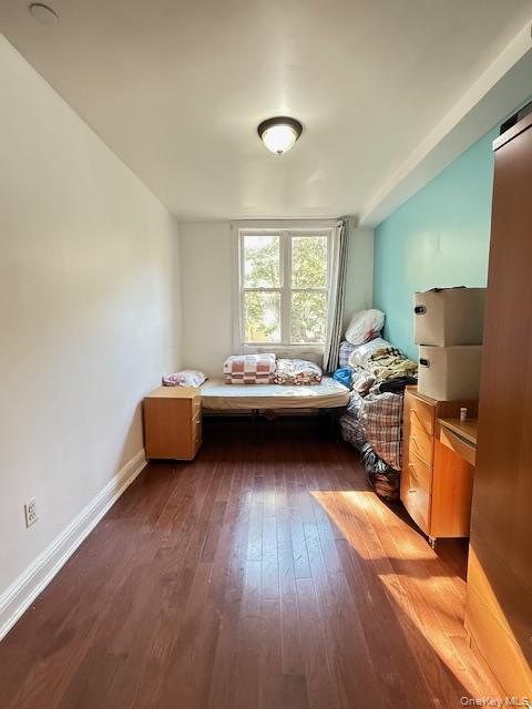 101-18 39th Avenue Queens, NY 11368 - Photo 3 of 13 a living room with furniture and a large window