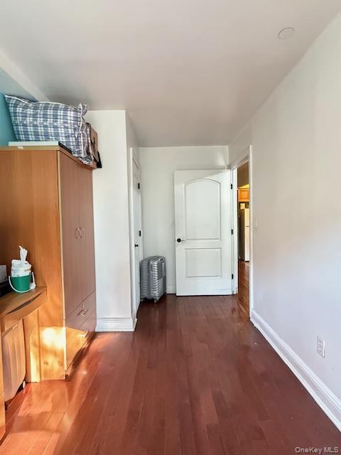 101-18 39th Avenue Queens, NY 11368 - Photo 5 of 13 wooden floor in an empty room