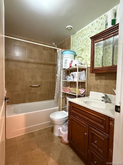 101-18 39th Avenue Queens, NY 11368 - Photo 6 of 13 a bathroom with a sink a toilet and shower