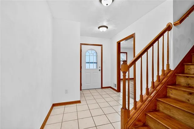 a view of an entryway with staircase