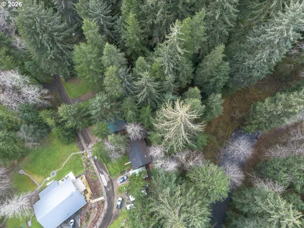 an aerial view of a house with a yard