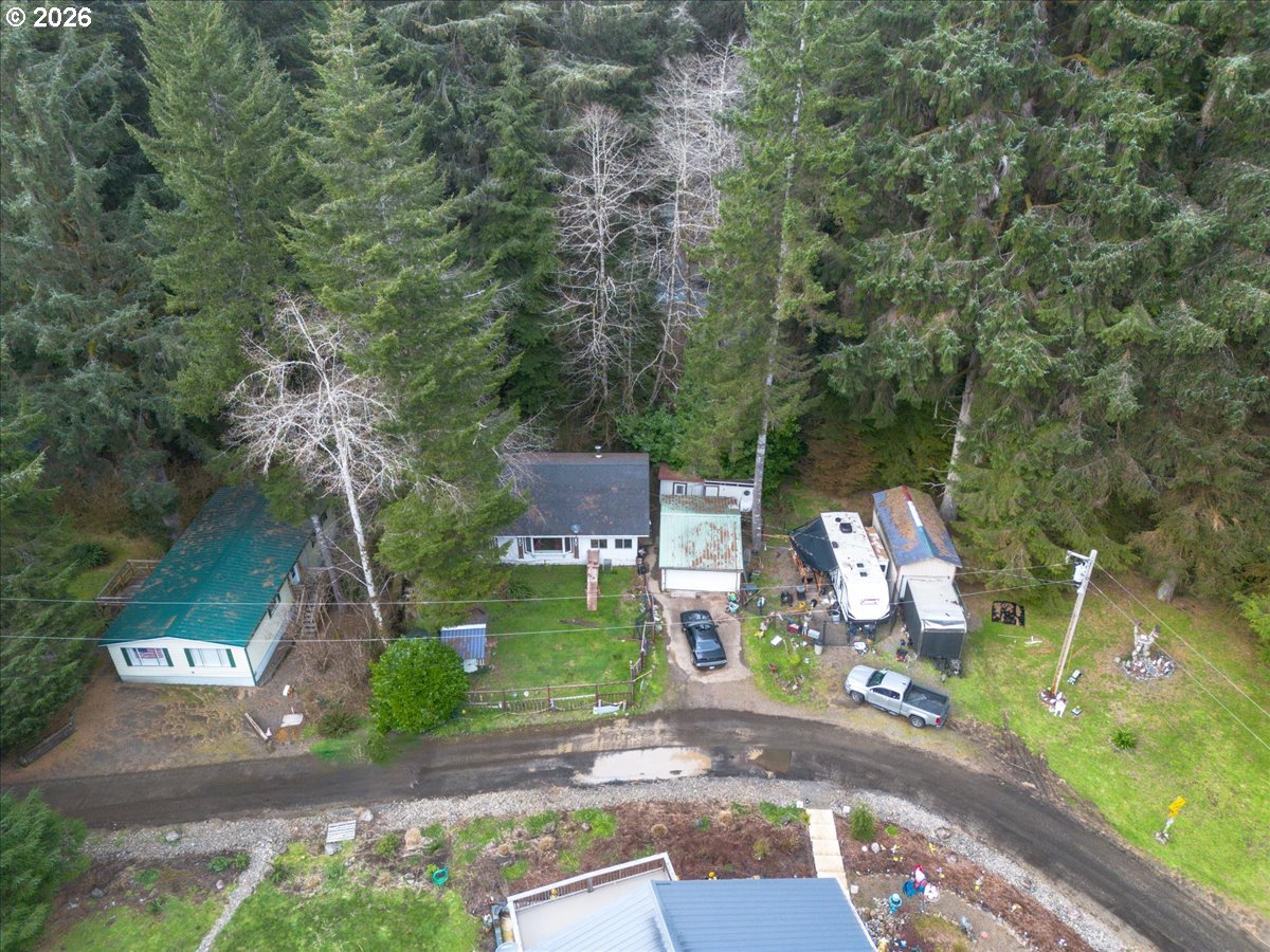 10840 Tillicum Loop Neskowin, OR 97149 - Photo 2 of 17 an aerial view of a house with a yard and garden