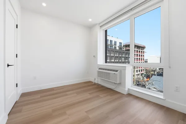 a view of an empty room with a window