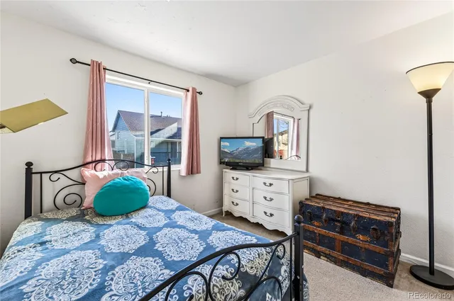 a bedroom with a bed and a cabinets