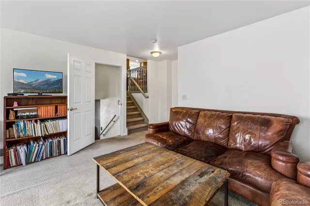 a bedroom with a bed and a television