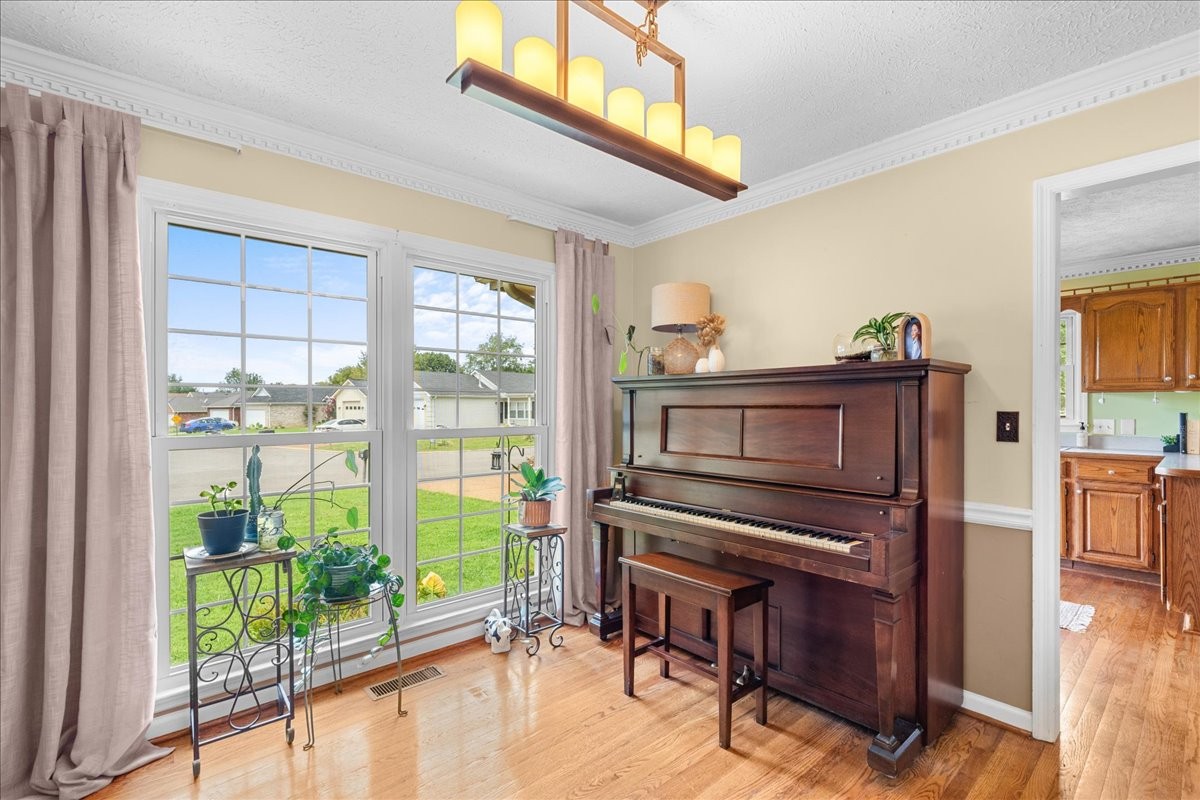 2014 Saddlebrook Drive Murfreesboro, TN 37129 - Photo 11 of 45 a living room with furniture a flat screen tv and floor to ceiling windows