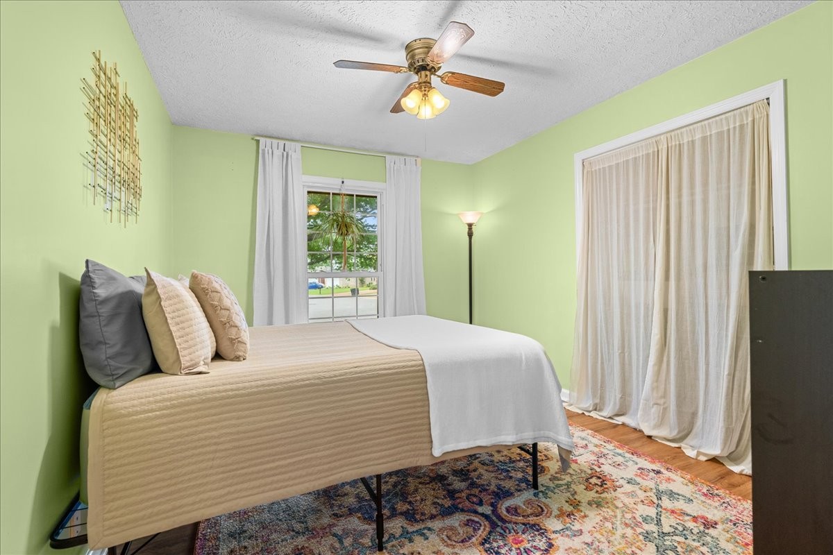 2014 Saddlebrook Drive Murfreesboro, TN 37129 - Photo 19 of 45 a bedroom with a bed and a chandelier