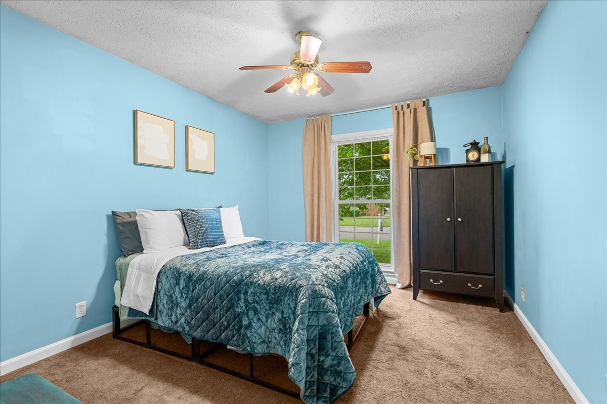 2014 Saddlebrook Drive Murfreesboro, TN 37129 - Photo 20 of 45 a spacious bedroom with a bed and a window