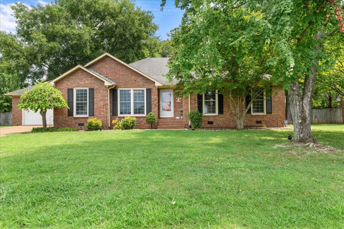 2014 Saddlebrook Drive Murfreesboro, TN 37129 - Photo 2 of 45 a front view of a house with a garden