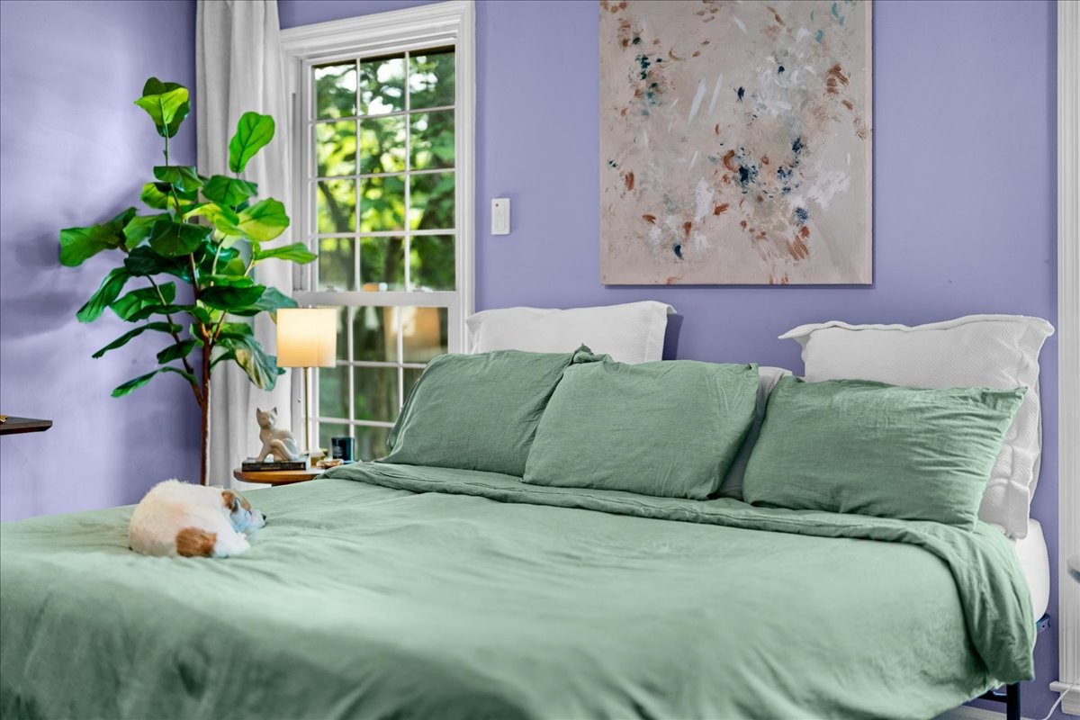 2014 Saddlebrook Drive Murfreesboro, TN 37129 - Photo 22 of 45 a bed sitting in a bedroom next to a window with potted plant