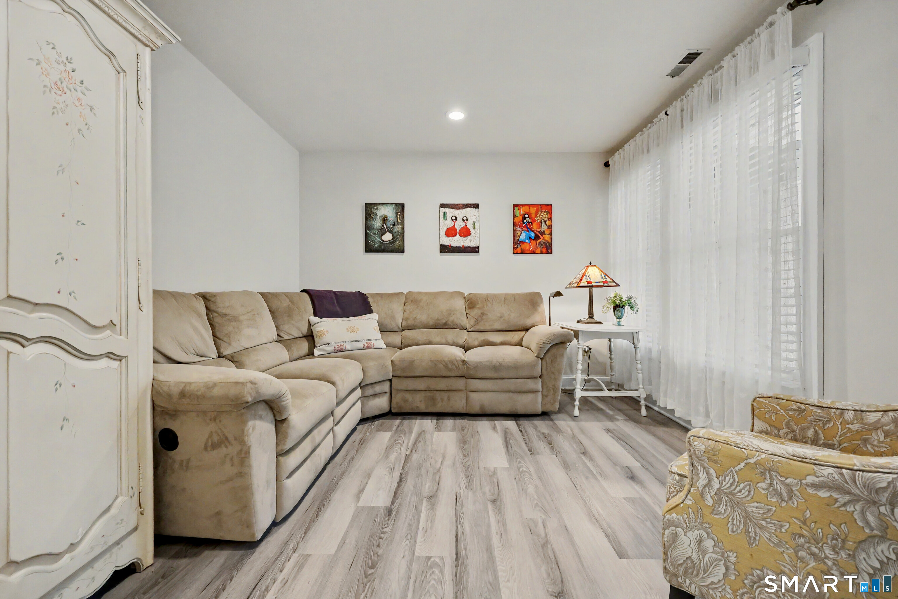 70 Fawn Ridge Lane, Unit 70 Norwalk, CT 06851 - Photo 12 of 36 a living room with furniture and a couch