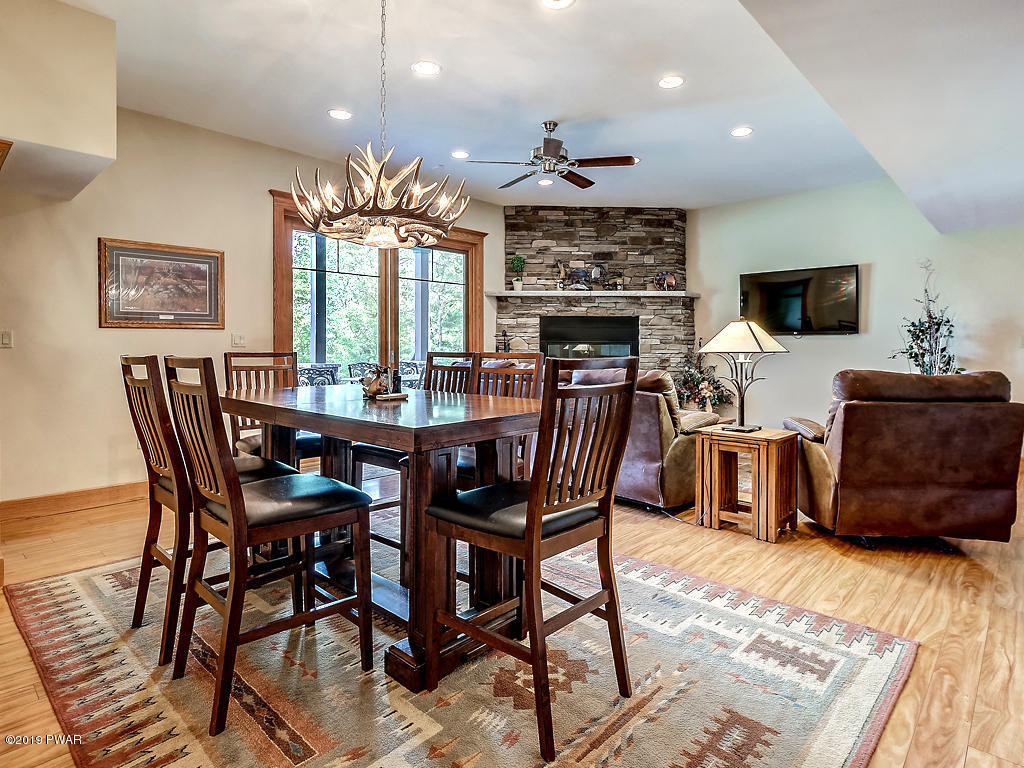 419 Bare Valley Road Montrose, PA 18801 - Photo 39 of 72 a view of a dining room with furniture and a chandelier
