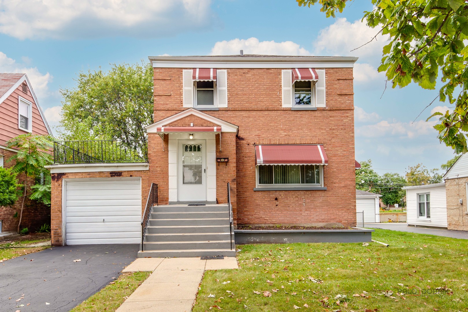 2320 South 22nd Avenue Broadview, IL 60155 - Photo 1 of 35 a front view of a house with a yard and garage