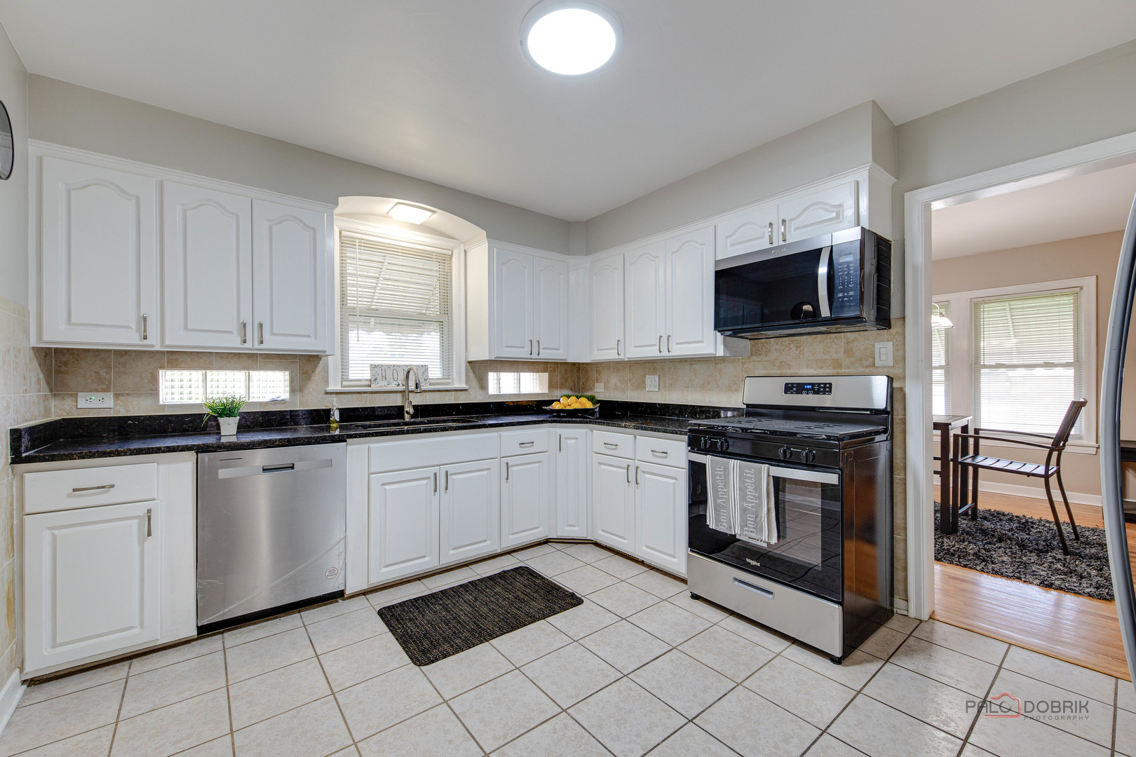 2320 South 22nd Avenue Broadview, IL 60155 - Photo 11 of 35 a kitchen with stainless steel appliances granite countertop a stove a sink and a microwave
