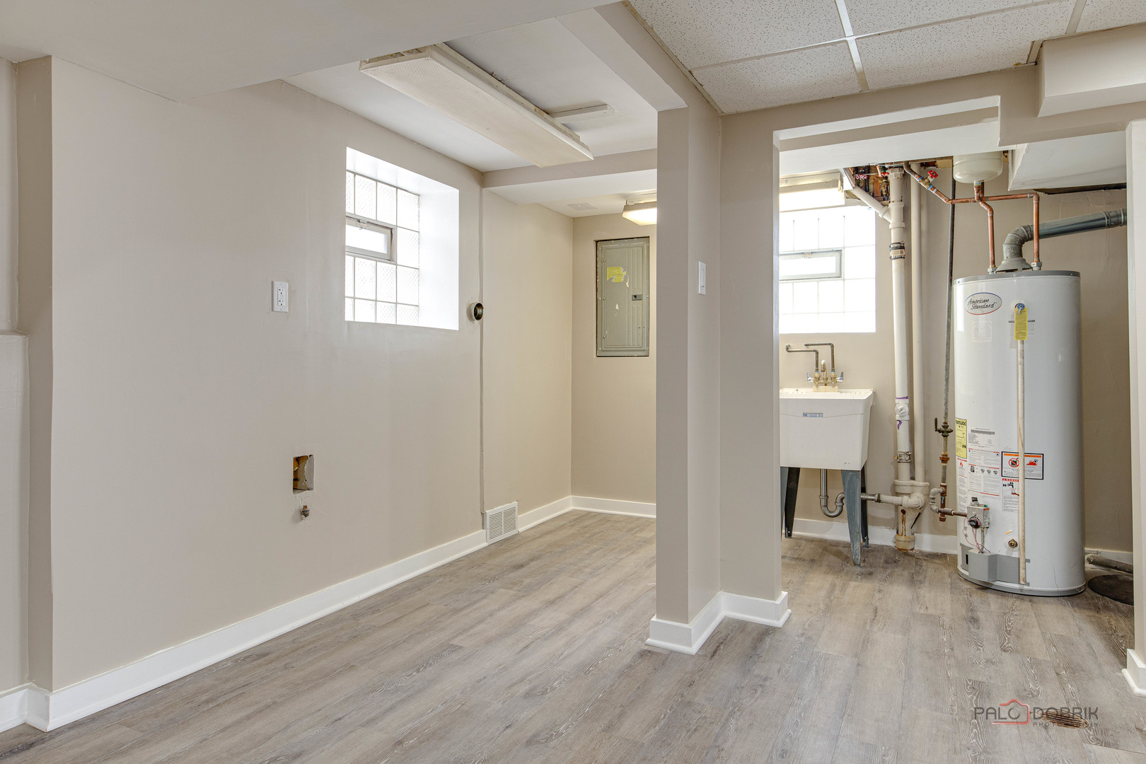 2320 South 22nd Avenue Broadview, IL 60155 - Photo 23 of 35 a view of an empty room with wooden floor and a window