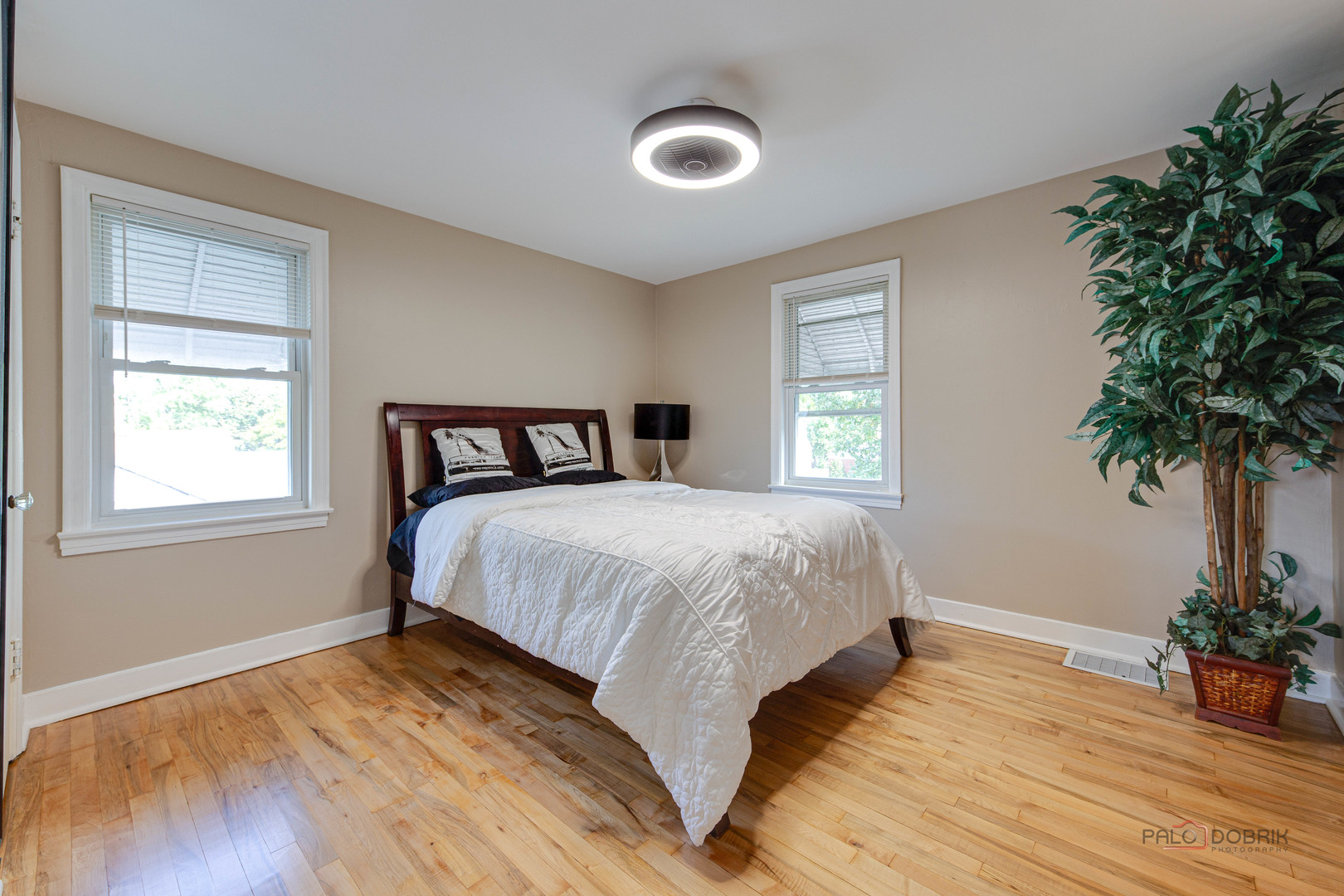 2320 South 22nd Avenue Broadview, IL 60155 - Photo 28 of 35 a bedroom with a bed and a potted plant