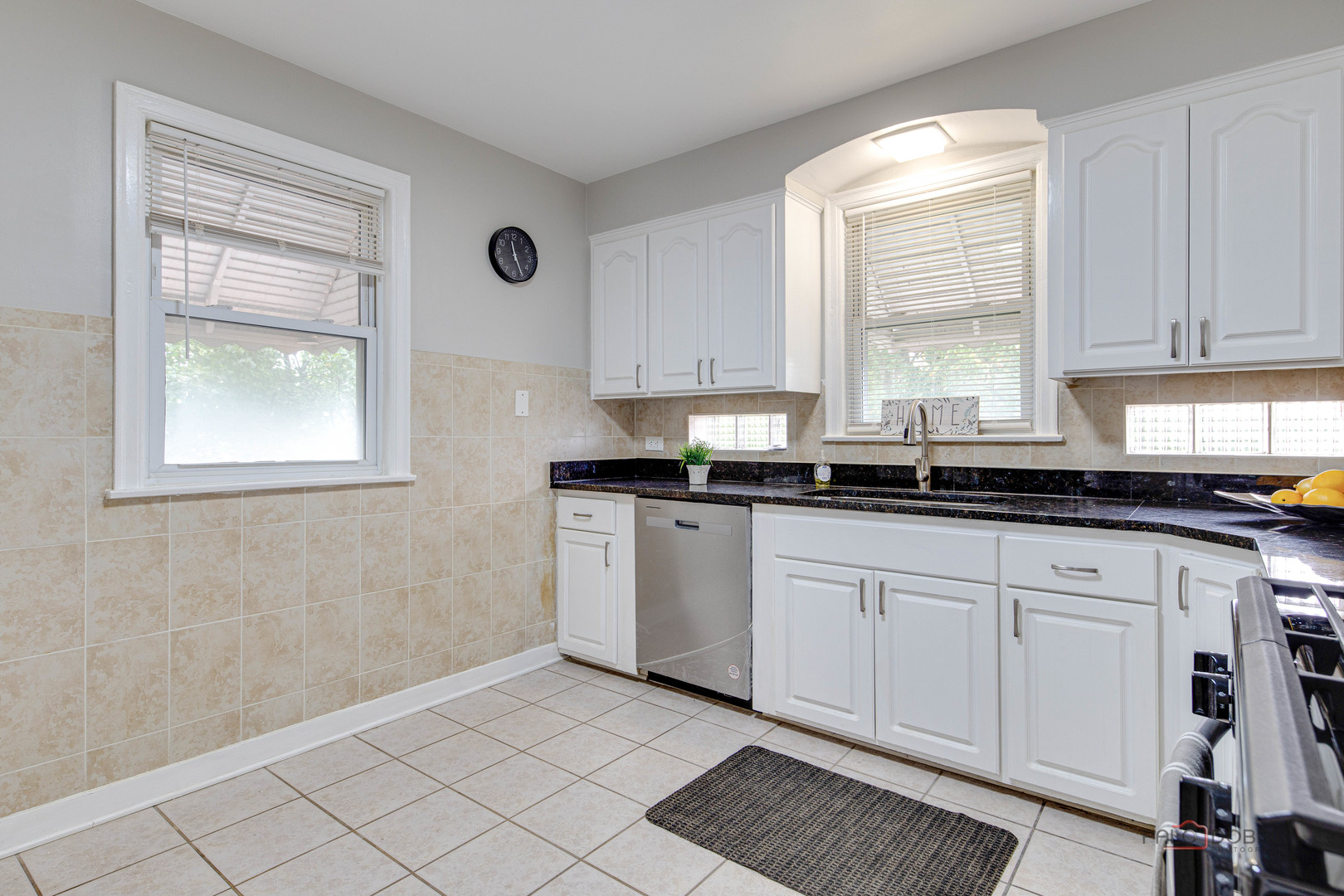 2320 South 22nd Avenue Broadview, IL 60155 - Photo 10 of 35 a kitchen with granite countertop white cabinets and window