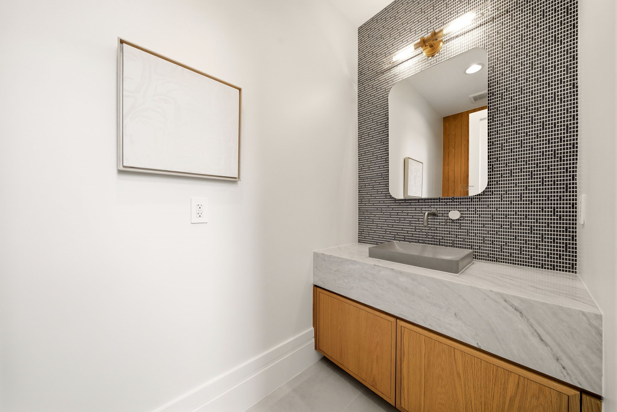 1023 Euclid Street Houston, TX 77009 - Photo 21 of 50 First floor stylish powder bath with floating-style marble vanity, designer lighting, and mosaic accent wall.