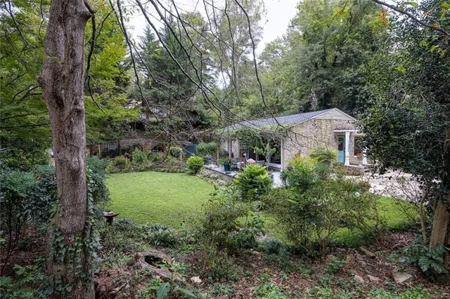 a aerial view of a house with a yard