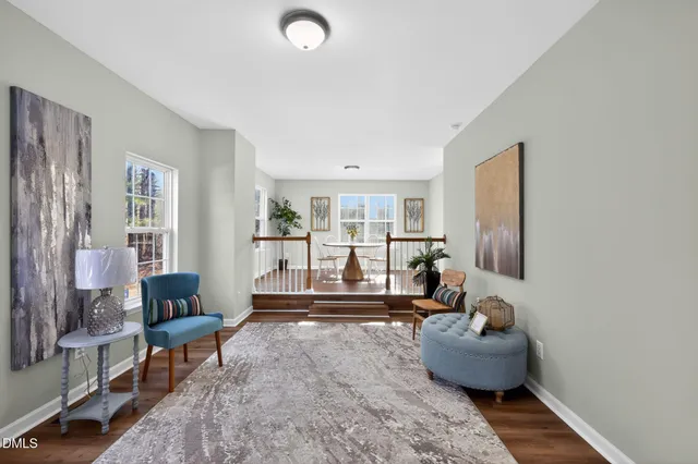 a living room with furniture and a table