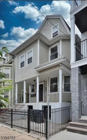 a view of a brick house with a large window