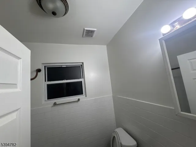 an empty room with a bathroom