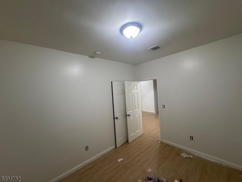 60 South 12th Street, Unit 3 Newark, NJ 07107 - Photo 7 of 9 an empty room with an entrance