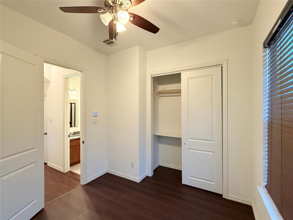 9815 Romo Street Irving, TX 75063 - Photo 14 of 25 a view of empty room with wooden floor