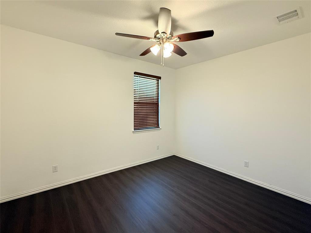 9815 Romo Street Irving, TX 75063 - Photo 18 of 25 wooden floor in an empty room
