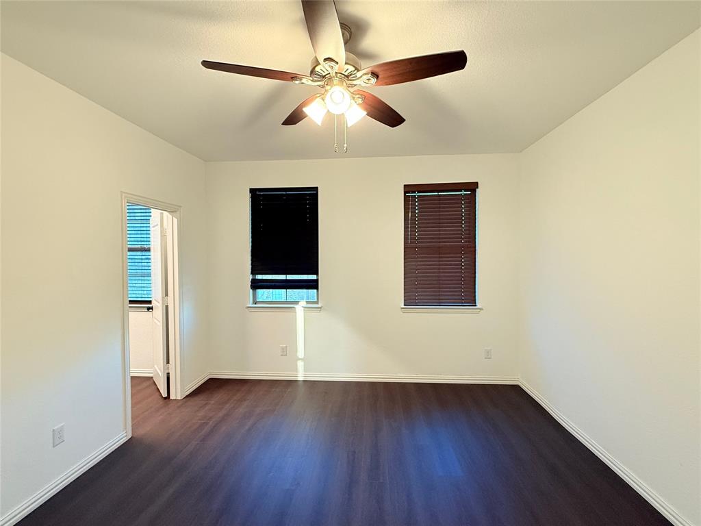 9815 Romo Street Irving, TX 75063 - Photo 20 of 25 a view of an empty room with wooden floor