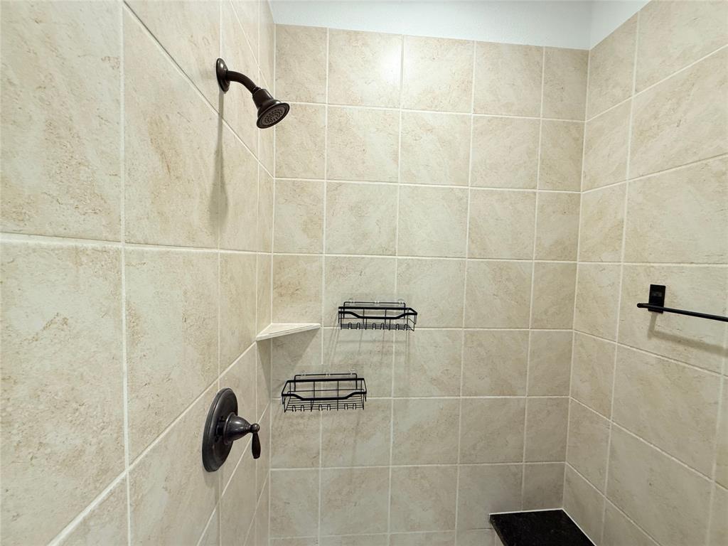 9815 Romo Street Irving, TX 75063 - Photo 22 of 25 a bathroom with a shower