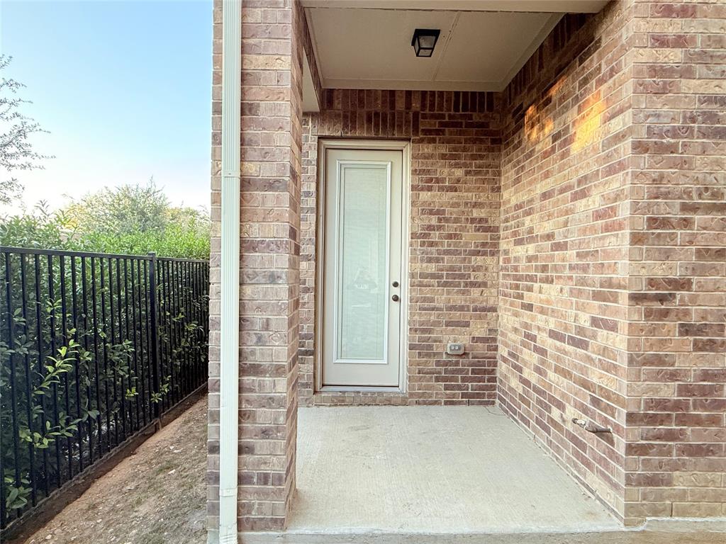 9815 Romo Street Irving, TX 75063 - Photo 24 of 25 a view of a door and wooden floor