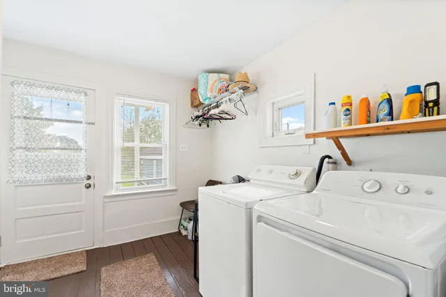 a view of storage and utility room with washer and dryer