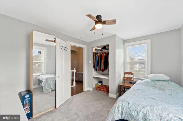 a bedroom with furniture and a chandelier
