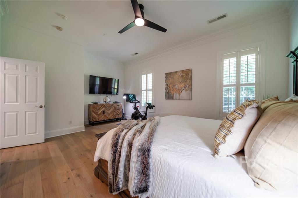 6309 Wakehurst Road Charlotte, NC 28226 - Photo 19 of 48 a bedroom with bed and a flat tv screen