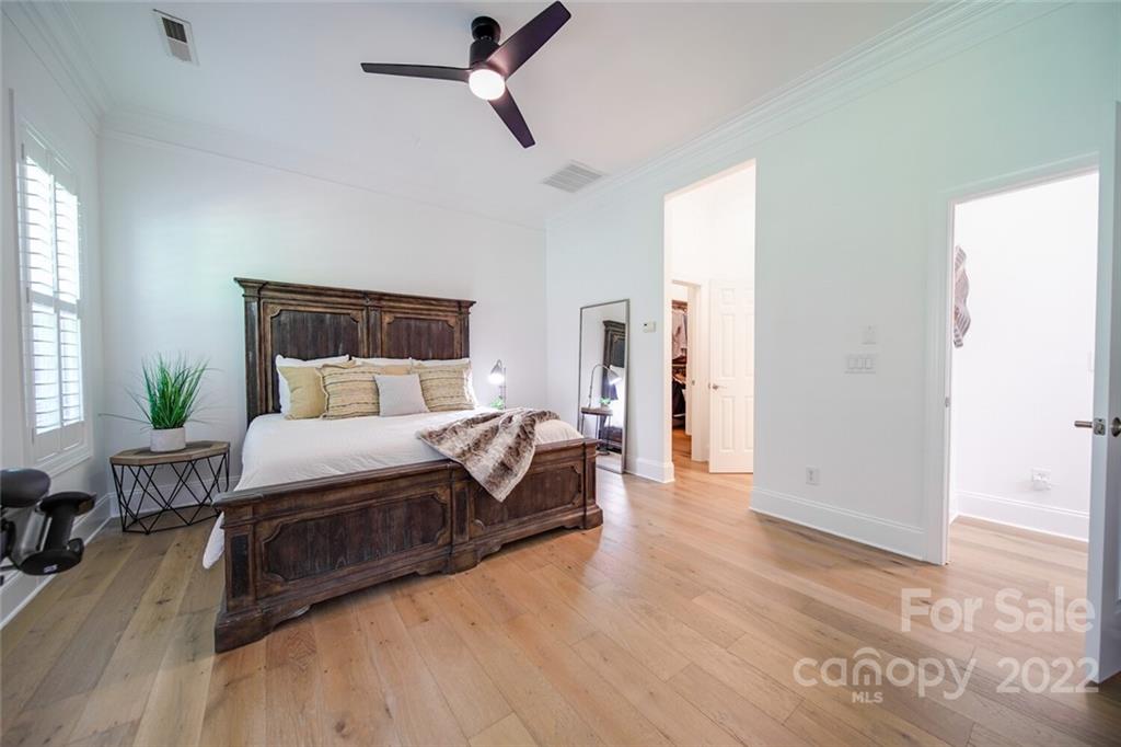 6309 Wakehurst Road Charlotte, NC 28226 - Photo 20 of 48 a spacious bedroom with a bed and a couch