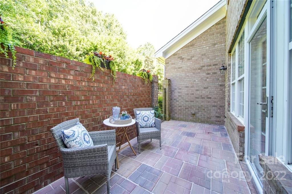 6309 Wakehurst Road Charlotte, NC 28226 - Photo 26 of 48 a view of a patio with chair and table