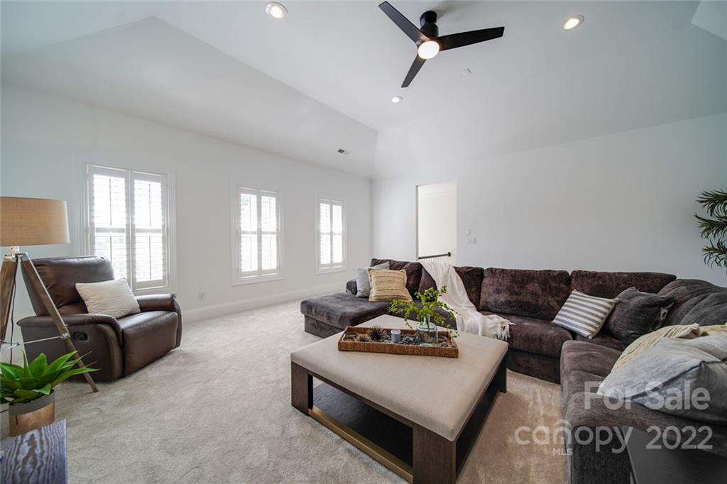 6309 Wakehurst Road Charlotte, NC 28226 - Photo 28 of 48 a living room with furniture rug and window