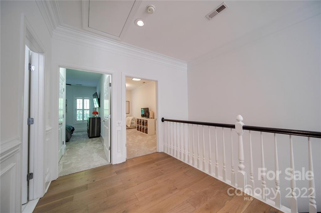 6309 Wakehurst Road Charlotte, NC 28226 - Photo 33 of 48 a view of a hallway with wooden floor