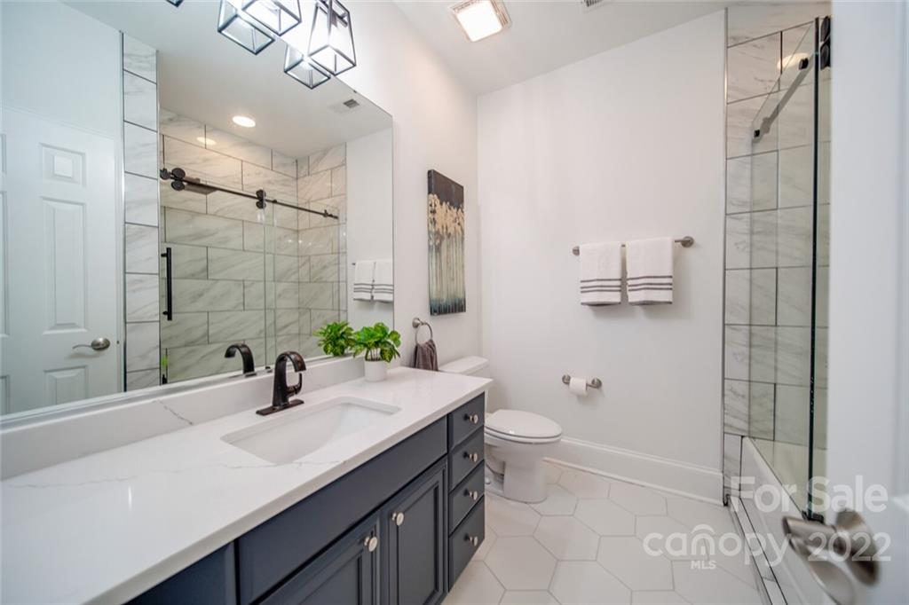 6309 Wakehurst Road Charlotte, NC 28226 - Photo 35 of 48 a bathroom with a double vanity sink toilet and shower