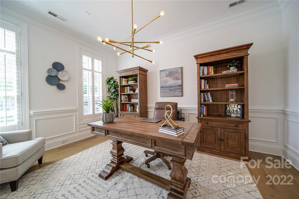 6309 Wakehurst Road Charlotte, NC 28226 - Photo 5 of 48 a view of a workspace with furniture and a window