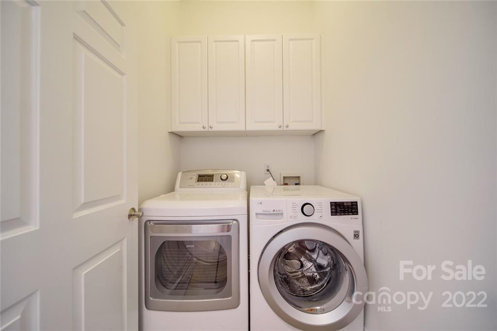 6309 Wakehurst Road Charlotte, NC 28226 - Photo 7 of 48 a utility room with dryer and washer