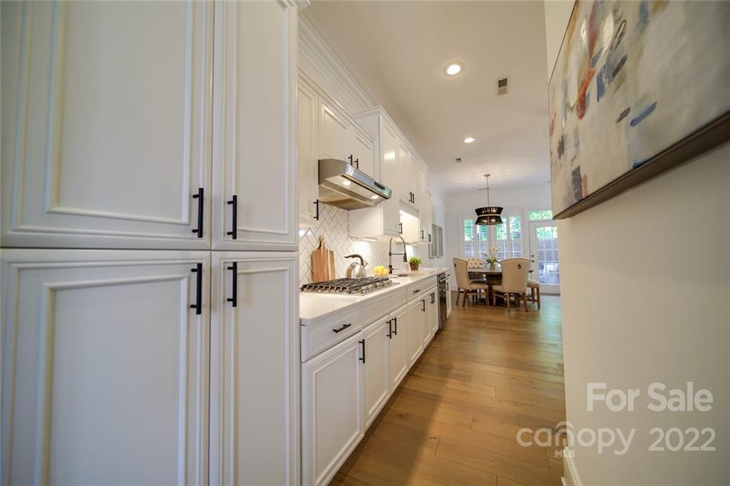 6309 Wakehurst Road Charlotte, NC 28226 - Photo 9 of 48 a kitchen with sink cabinets and window