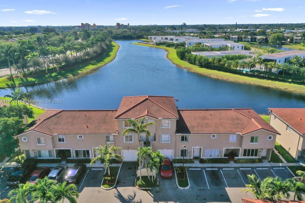 an aerial view of a house with a lake view