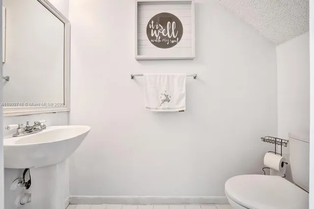 a view of a hallway with white walls